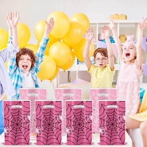 Close-up of 8 pink spiderweb gift bags with handles in a cheerful party background