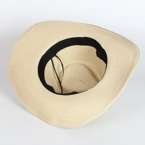 Detail of straw hat interior with black sweatband and adjustable drawstring