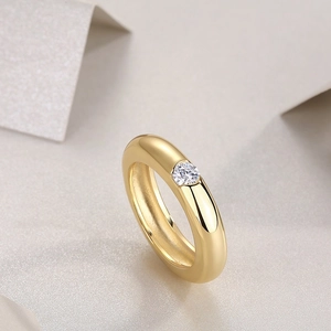 Minimalist 18K gold S925 silver ring with centered moissanite in a wide band design