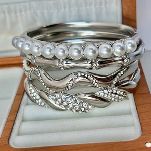 Silver stainless steel stacked bracelet set with 18K gold plating, pearls and crystals