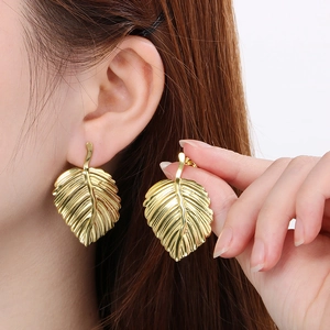 Retro golden leaf statement earrings with detailed vein texture for a vintage aesthetic