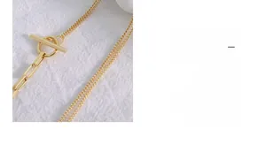Detailed view of 18k gold plated titanium necklace with OT toggle clasp and mixed links