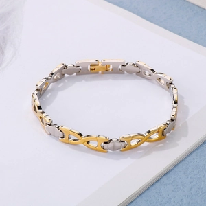 Close-up of gold and silver two-tone hollow link chain bracelet with a secure clasp