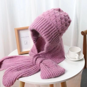 Detail of taro purple chunky knit hooded scarf on a white wooden table in cozy setting