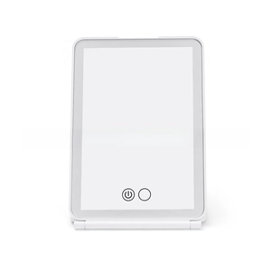 Detail of white foldable travel makeup mirror with LED light and touch control buttons