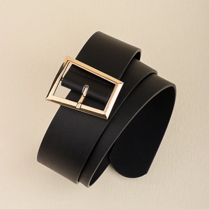 Detailed close-up of a black leather belt featuring a polished gold rectangular metal buckle