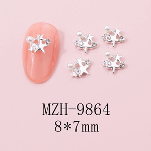 Macro view of 8x7mm silver hollow star nail charms with white pearls and rhinestones