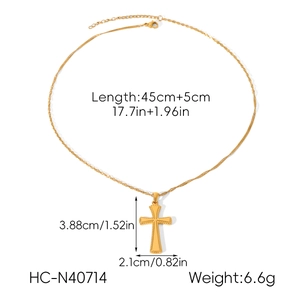 Detailed view of golden 18k cross pendant necklace with measurements and twisted chain