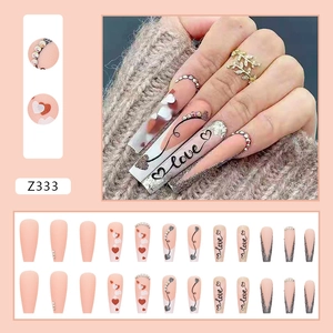 Long ballet press-on nails with 3D rhinestones, love heart art, and pink matte finish