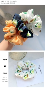 Detailed avocado print scrunchies in multiple colors with elastic fabric texture