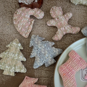 Christmas tweed fabric ornaments set with gold thread including trees and socks