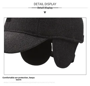 Close-up of thick dark grey earflap hat for men with warm thermal lining and folding design