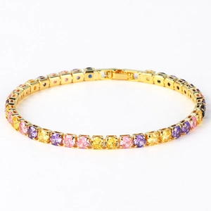 Macro view of gold tennis bracelet with colorful square-cut zircons and security clasp