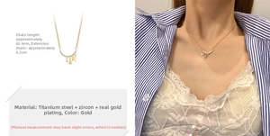 Detailed view of crescent moon gold necklace with star charms on titanium steel chain