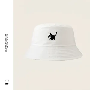 White cotton bucket hat with cute cat embroidery and minimalist sun protection design