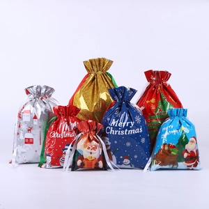 Colorful Christmas drawstring foil gift bags with festive Santa and snowman patterns