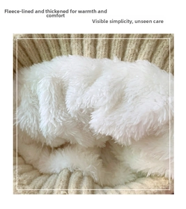 Close-up of thick white fleece lining and chunky knit texture of a warm winter hat