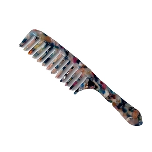 Elegant wide-tooth acetate hair comb with blue marble pattern on white background