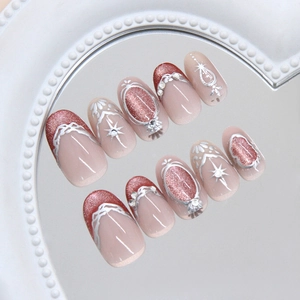 Cat eye press-on nails with red persimmon crystal glitter and diamond accents