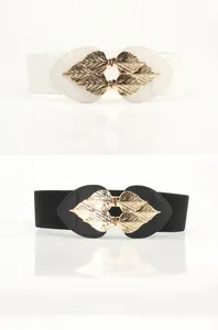 Close-up of elastic waist belts featuring elegant gold leaf buckles in black and white