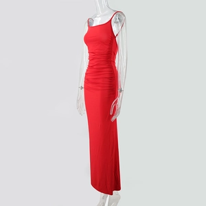 Detail view of red slim fit maxi dress featuring side ruching and spaghetti straps