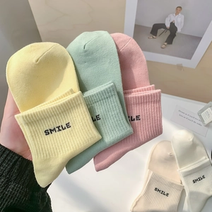 Colorful SMILE embroidered mid-calf cotton socks in candy tones with ribbed cuffs