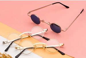Detail view of small round steampunk sunglasses with metal frames in various colors