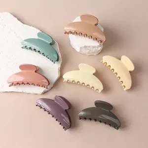 Glossy half-moon hair claw clips set in 7 pastel colors for elegant hair styling