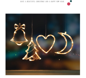 Close-up of LED Christmas hanging lights featuring warm white bell and moon shapes