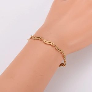 Vintage irregular geometric S-shaped gold stainless steel bracelet with sandblasted finish