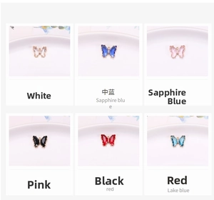 Close-up of gradient crystal butterfly pendants in six vibrant colors for DIY jewelry making