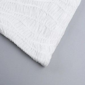 Macro shot of white pleated texture fabric for backless evening dresses