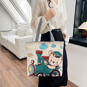 Cute cartoon bear printed canvas tote bag with striped handles and spacious interior