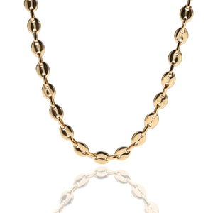 Detail of gold coffee bean link necklace showing polished finish on a white background
