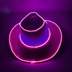 Detail of pink LED neon lights glowing on the brim of a holographic party cowboy hat