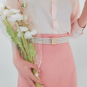 Detailed view of multi-layer pearl waist chain with a square rhinestone metal buckle