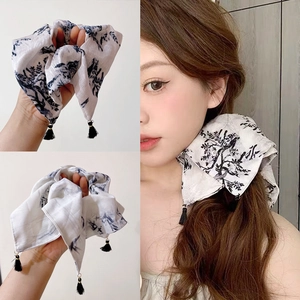 Elegant white checkered bow hair scrunchie with black tassel for ponytail styling
