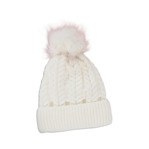 Detailed knit texture of white cable knit beanie with faux fur pom pom decoration