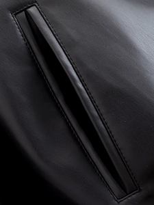 Detail of premium black leather jacket pocket with precise stitching and natural texture