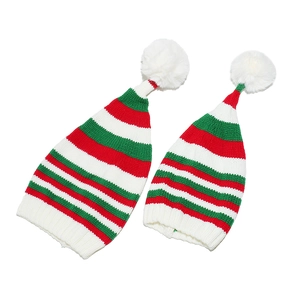 Knitted Christmas elf hats with red green and white stripes and large white pom poms