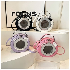 Various colors of unique washing machine shaped mini round bags on display stand