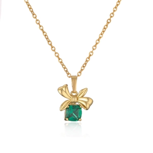 Elegant gold necklace with bow pendant featuring a square deep green gemstone detail