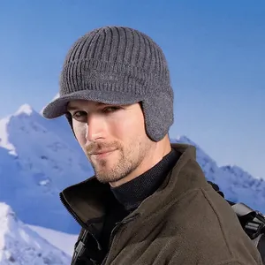 Gray knitted trapper hat with visor and Sport embroidery for winter outdoor sports