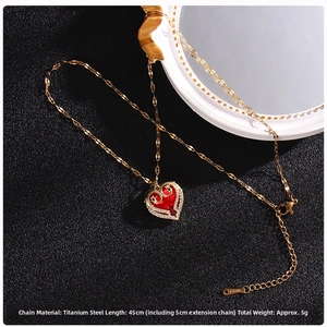 Detailed view of red heart pendant necklace with gold titanium steel and 5cm extender