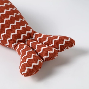 Linen fish-shaped cat toy with orange zigzag pattern for pet biting and dental health