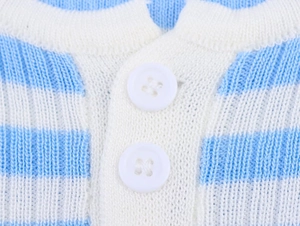 Close-up of white buttons and blue striped knit texture on the crewneck neckline