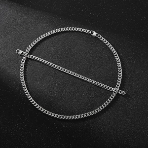 Close-up of silver titanium steel Cuban chain bracelet with flat polished metal links