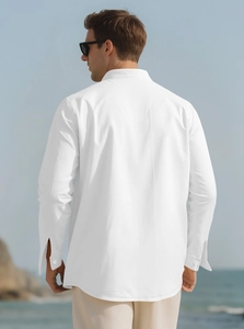 Back view of a white linen long sleeve casual shirt for men on a scenic beach background