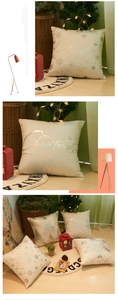 Detail of white Christmas pillow cover with silver snowflake and tree silver foil prints