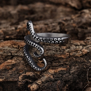 Macro detail of octopus tentacle ring featuring textured suckers and antique silver finish